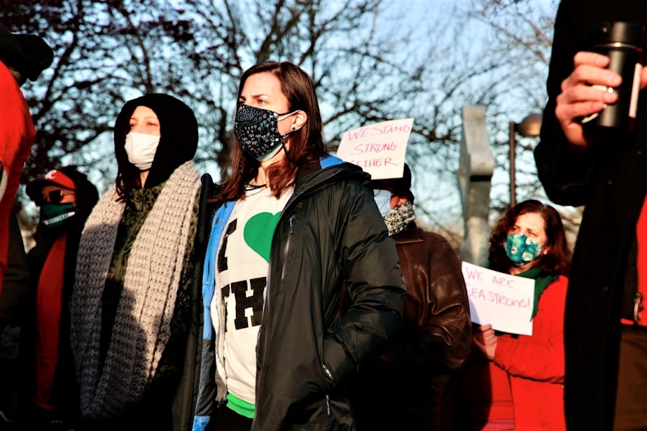 caption: Franklin High School staff and parents rallied outside the building on Tuesday, March 30, 2021.