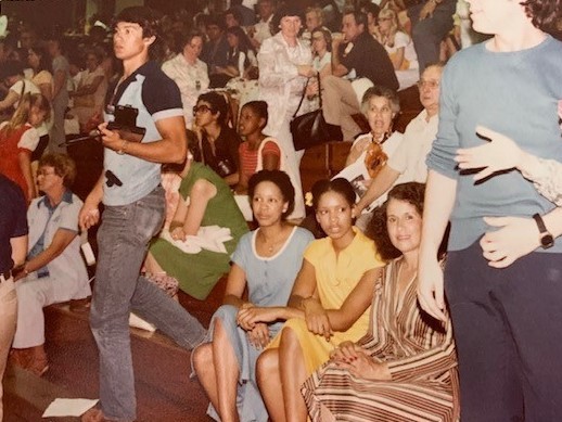 caption: Colette Baptiste-Mombo and her family at Jackson Memorial High School in 1974