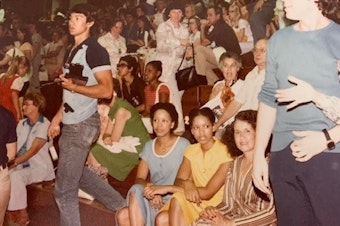 caption: Colette Baptiste-Mombo and her family at Jackson Memorial High School in 1974
