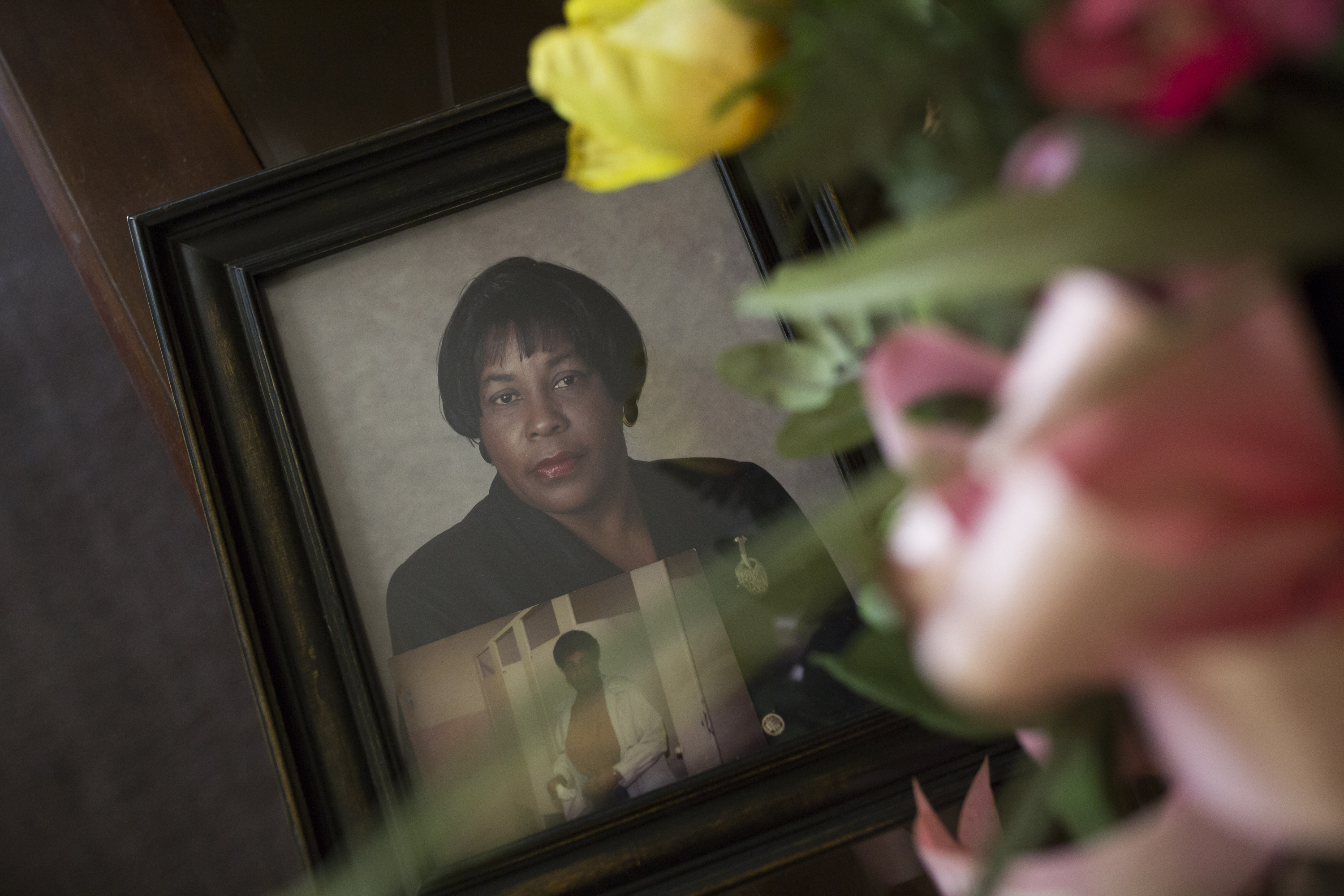 caption: A photo of his late wife, Frances McMillan Grissett, sits on the coffee table at Levi Grissett's home.