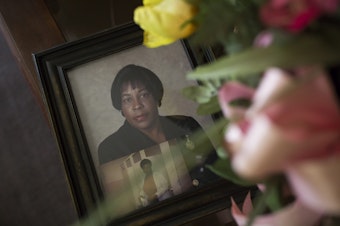caption: A photo of his late wife, Frances McMillan Grissett, sits on the coffee table at Levi Grissett's home.