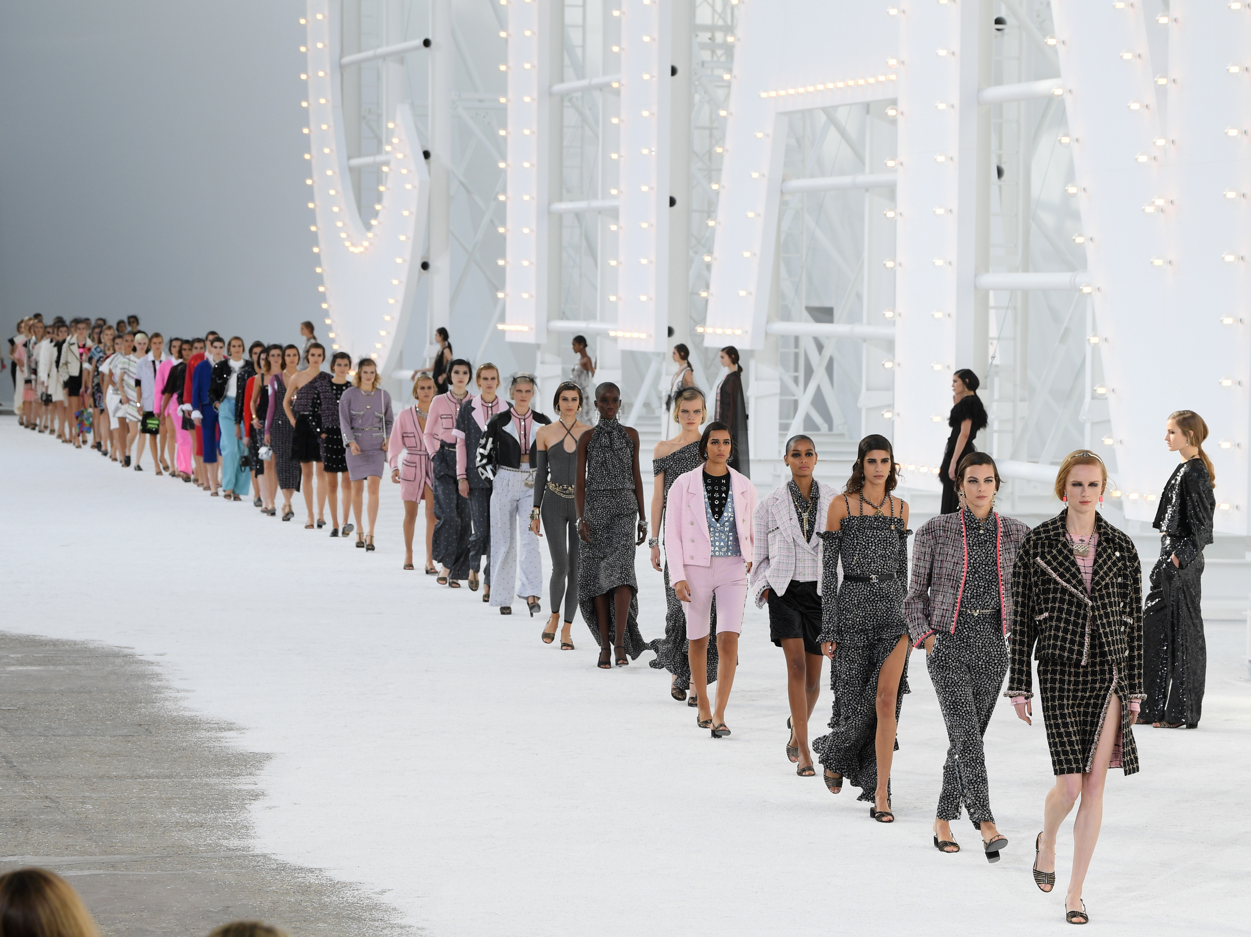 caption: Models walk the runway during the Chanel Womenswear Spring/Summer 2021 show as part of Paris Fashion Week on Oct. 06, 2020.