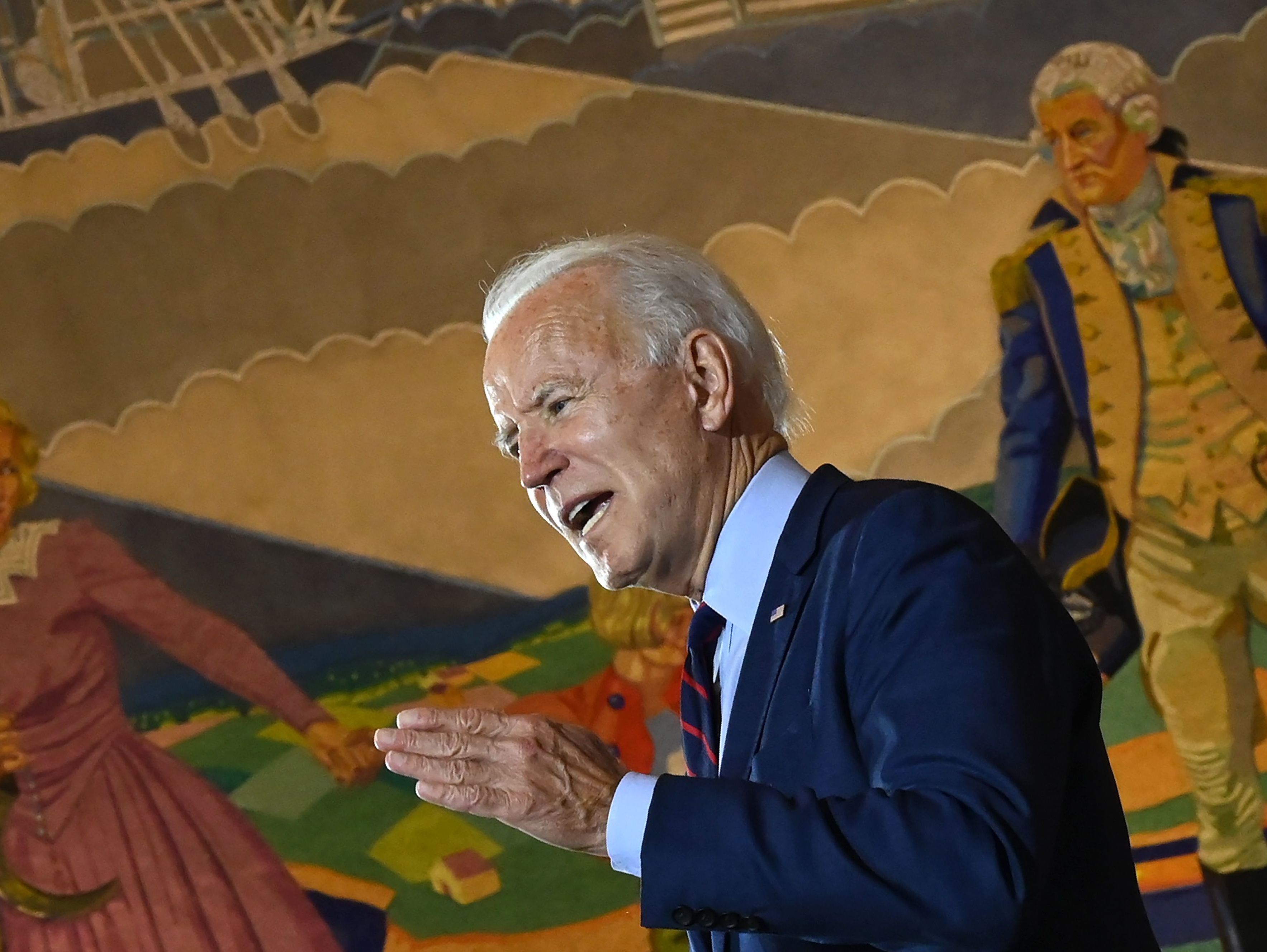 caption: Democratic presidential nominee Joe Biden, seen here at a campaign event in Cincinnati, Ohio, on Monday, told a local TV station he is "not a fan" of court packing.