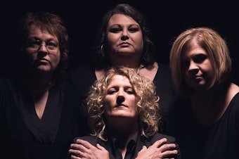 caption: Dale Ann Bradley (left), Tina Adair, Gena Britt Tew and Deanie Richardson (center) of the bluegrass band Sister Sadie do their impression of the rock band Queen.