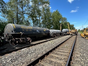 caption: Derailed tanker cars carrying hazardous materials lie on their sides in Custer, Washington, on June 5, 2024.