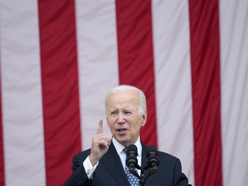 caption: President Joe Biden speaks at the Memorial Amphitheater of Arlington National Cemetery in Arlington, Va., on Memorial Day on Monday.