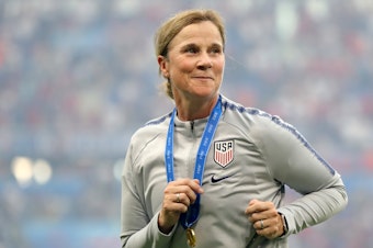 caption: U.S. Women's National Team coach Jill Ellis celebrates after the American squad defeated the Netherlands on July 7 in France to win the FIFA Women's World Cup.