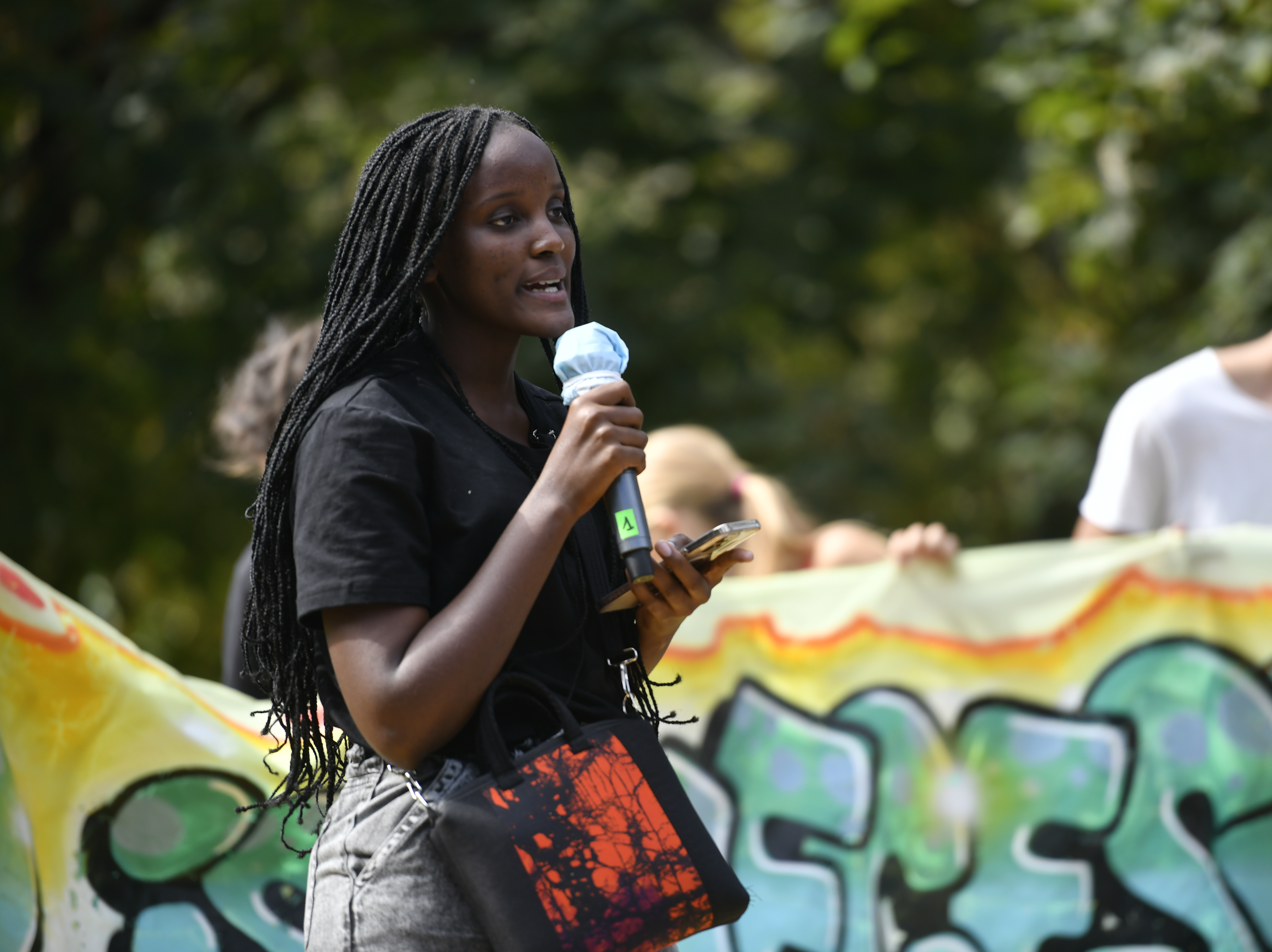 caption: Vanessa Nakate speaks during the climate strike march on October 1, 2021 in Milan, Italy.