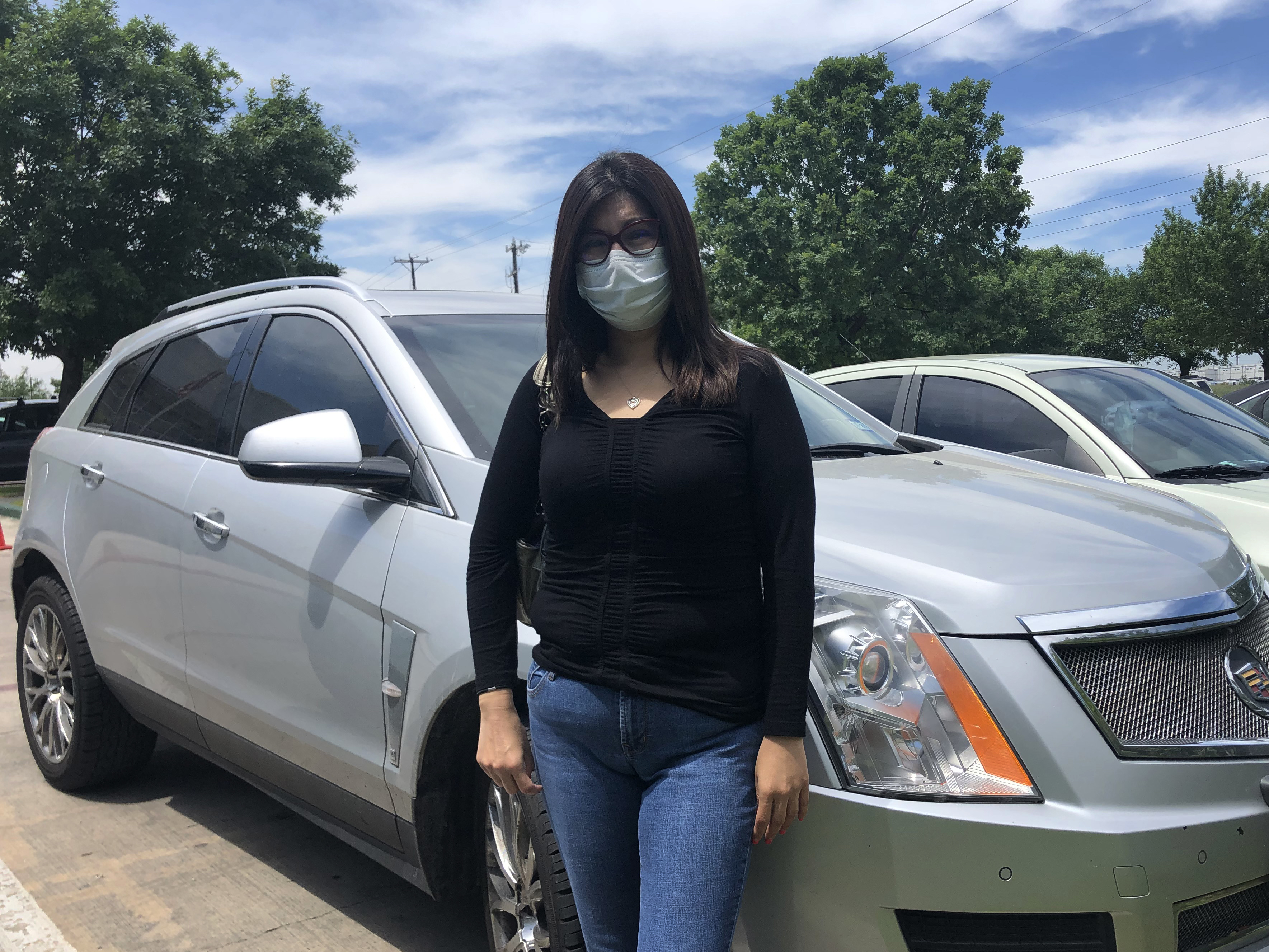 caption: Erica Campos says she initially felt ashamed driving up to the food bank in her used Cadillac, but "there's no shame in feeding my children."