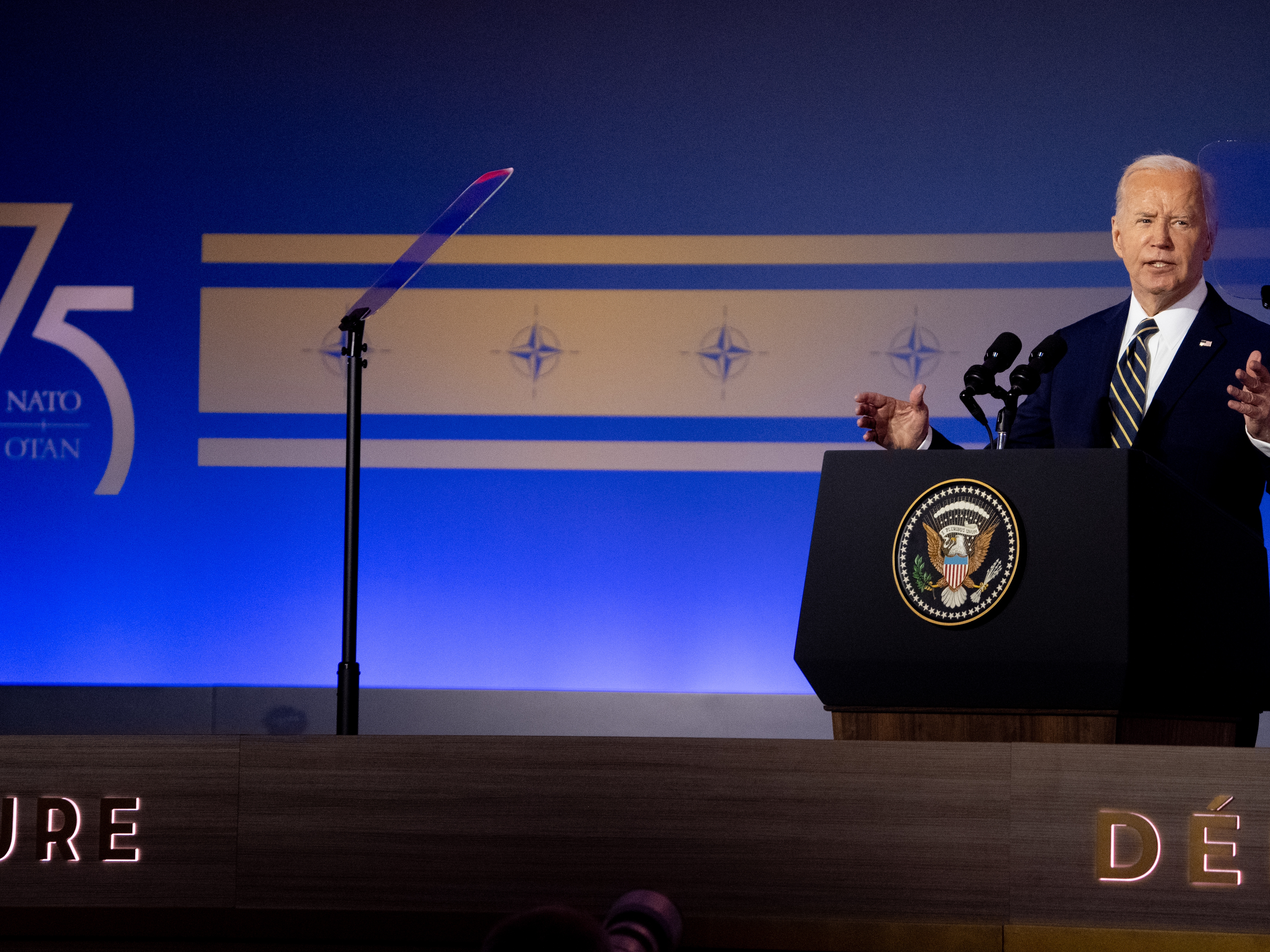 caption: President Biden speaks during a NATO 75th anniversary celebratory event at the Andrew Mellon Auditorium on July 9 in Washington, D.C. 