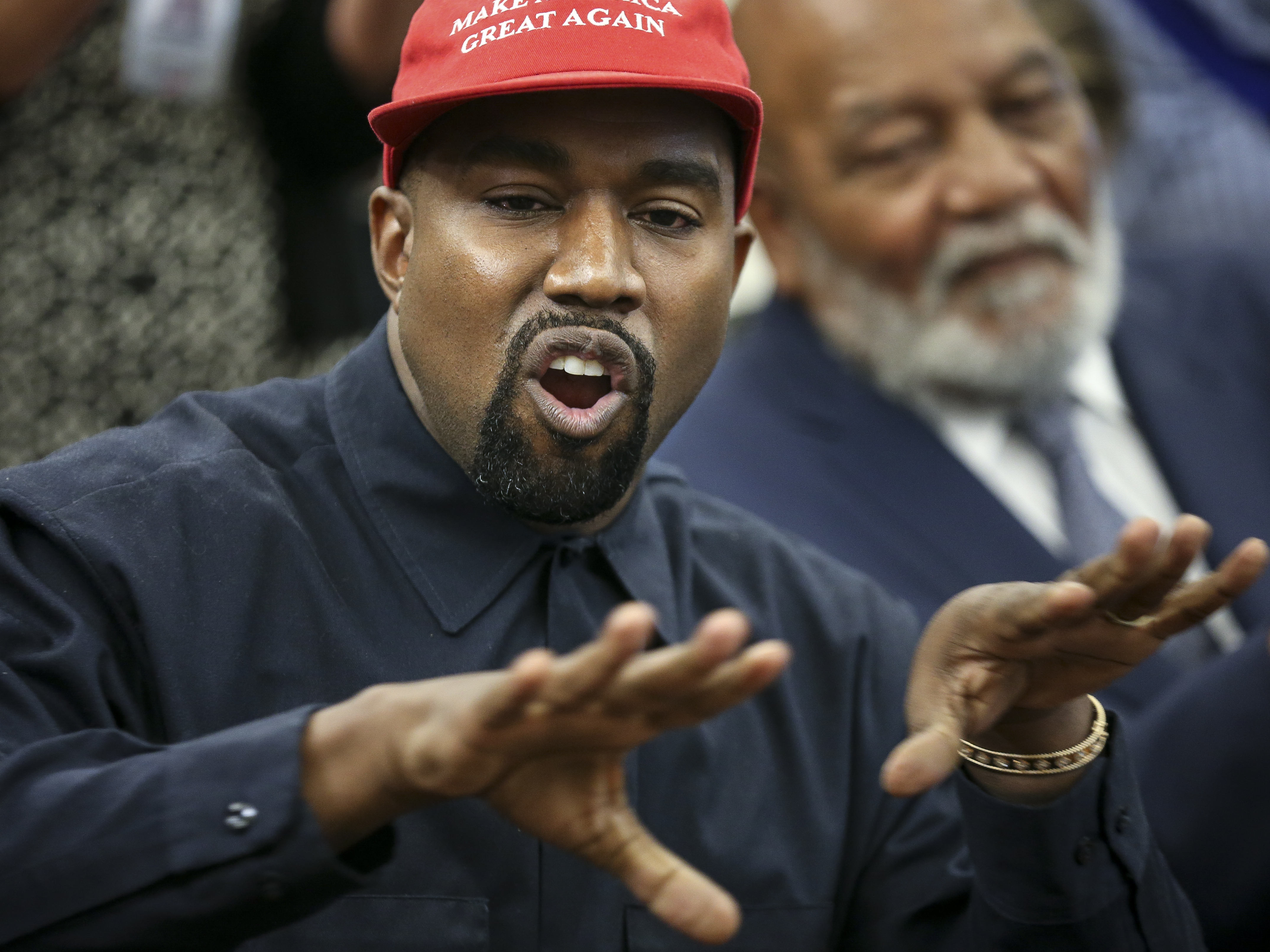 caption: Rapper Kanye West speaks during a meeting with U.S. President Donald Trump in the Oval office of the White House in 2018.