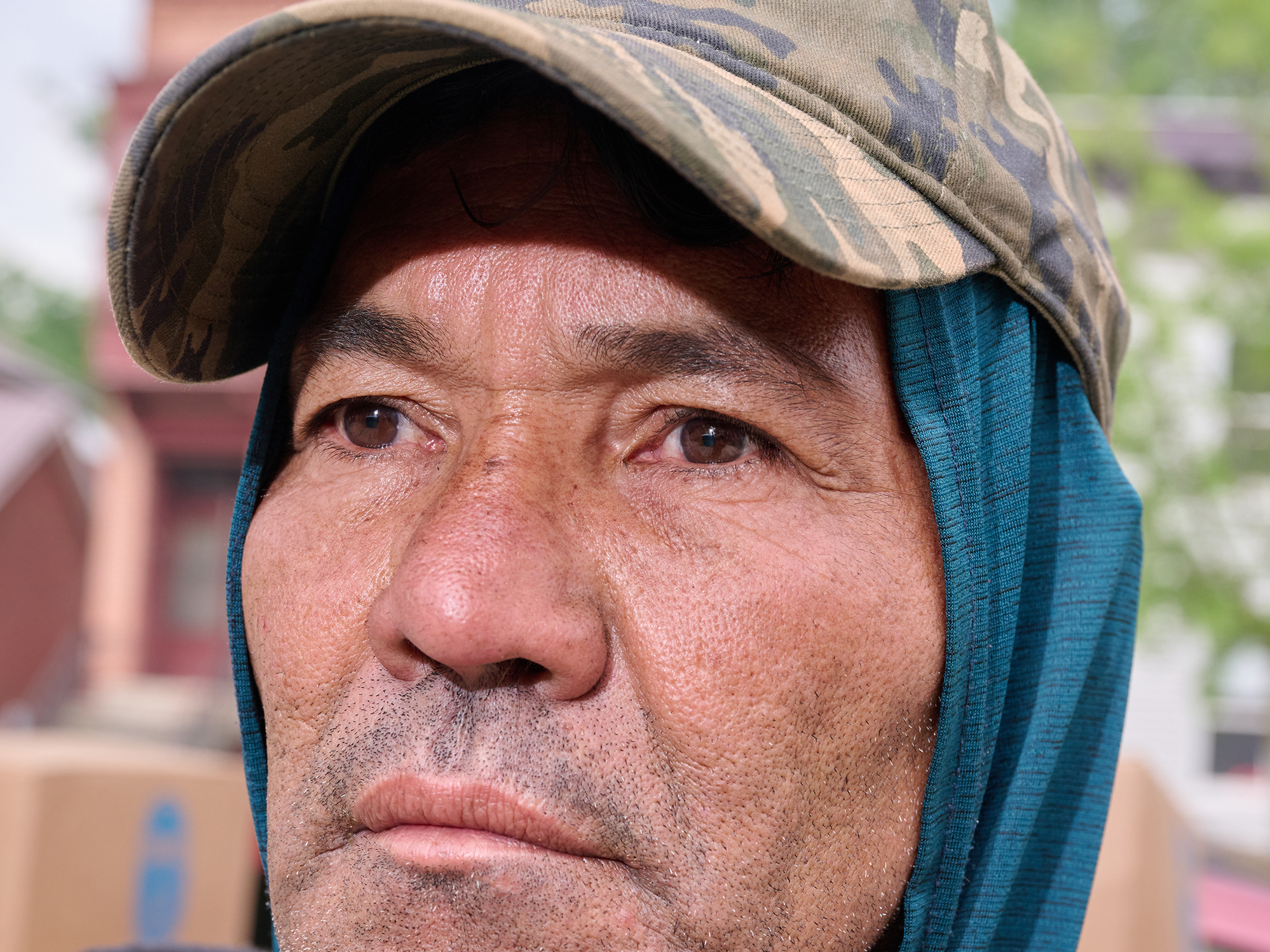 caption: Juan Carlos, recently arrived in Albany, N.Y. after being bused to various cities in the US. He is from Nicaragua, and volunteers with local non-profits in the city as a way to get to know the community and find work.