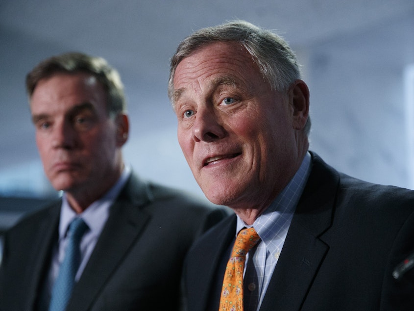 caption: Sens. Richard Burr, R-N.C., (right) and Mark Warner, D-Va., — pictured in September 2018 — released a report on election security Thursday.