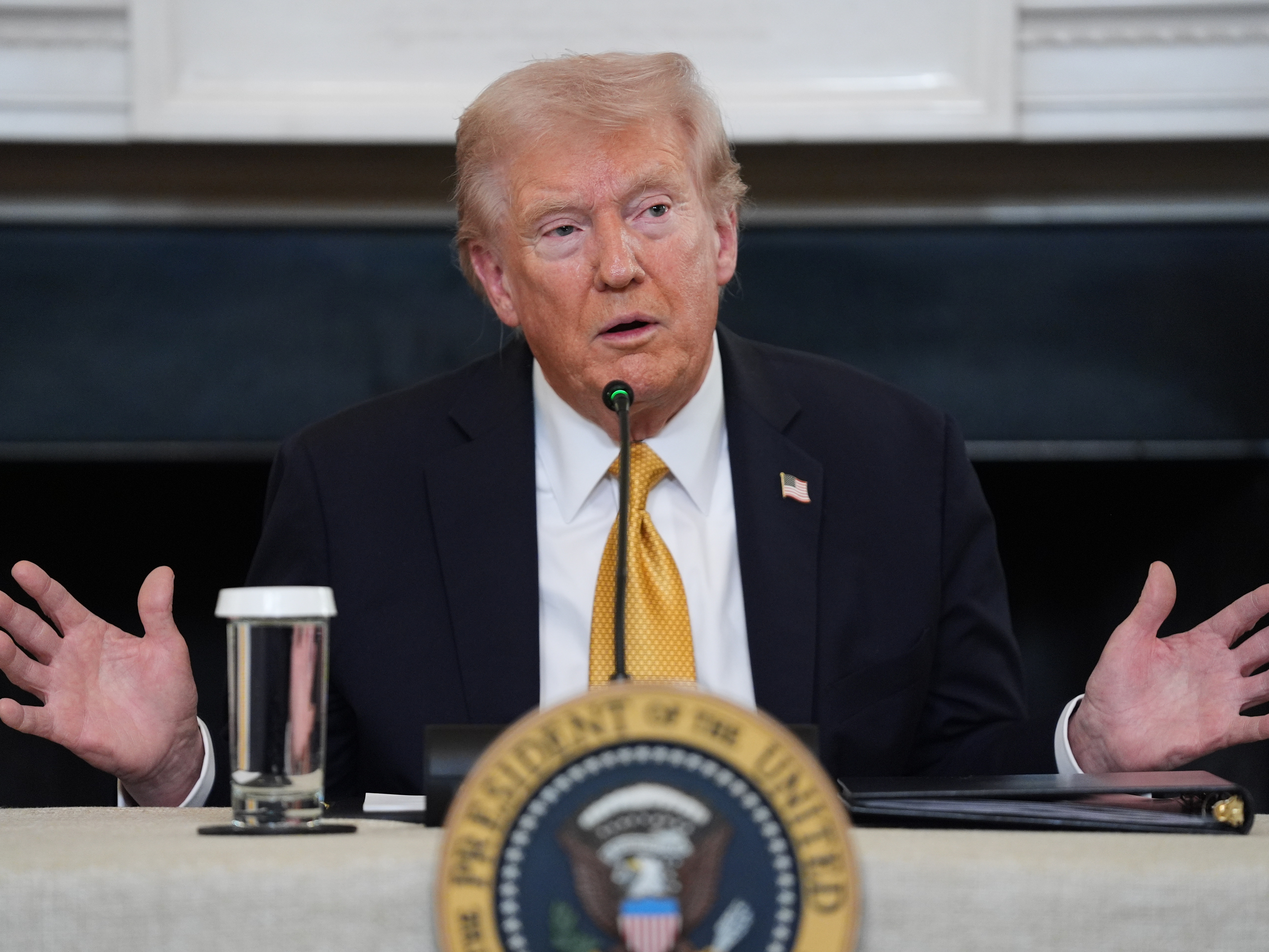 caption: President Donald Trump answers questions from reporters during a roundtable on criminal cartels in the State Dining Room of the White House, Thursday, Oct. 23, 2025, in Washington.