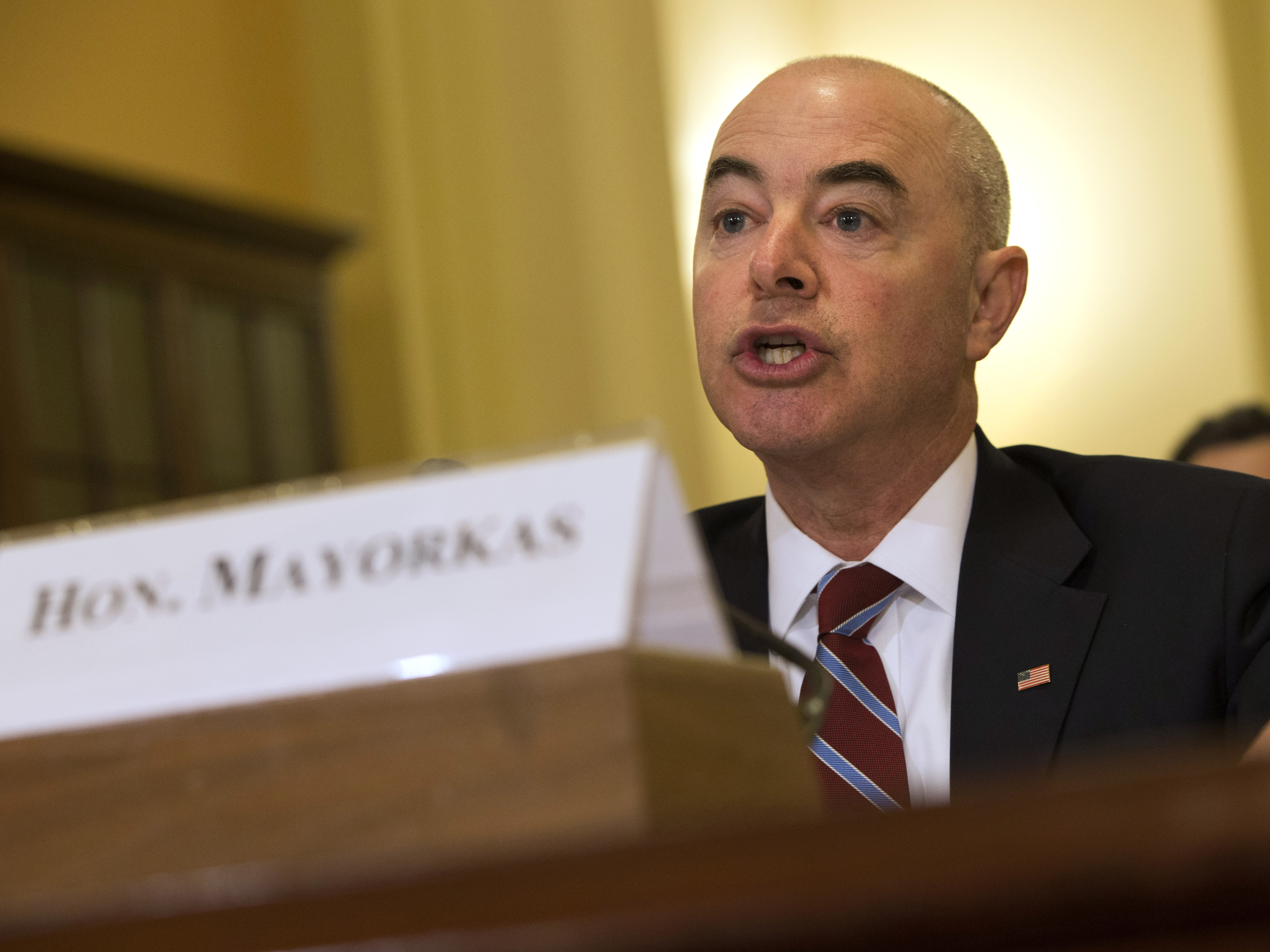 caption: Alejandro Mayorkas testifies before a House committee in 2015.