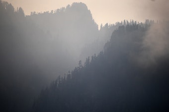 caption: Smoke from the Bolt Creek Fire is shown on Monday, Sept. 12, 2022, along Reiter Road outside of Index. 