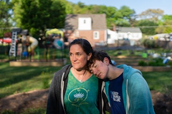 caption: Jenna Fournel and Leal Abbatiello, 14, pose for a portrait at their home in Alexandria, Va. on April 30, 2022. Since the start of the pandemic in 2020, Fournel and her son expanded their garden and began harvesting and giving away produce for free to their community.
