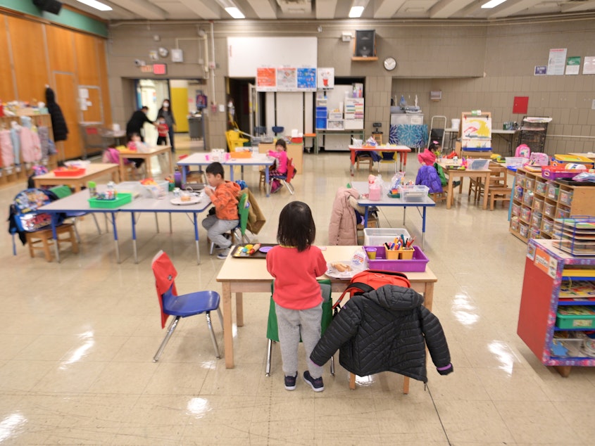 caption: Students attend a pre-K class at P.S. 124 in New York City on Jan 13, 2021. A new report found enrollment drops at state-based preschool programs during the 2020-2021 school year.