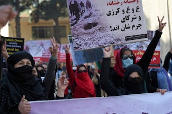 caption: The Taliban has a history of supporting the use of stoning as a punishment for "moral crimes" — reiterated in a statement this year by their supreme leader. Above: In 2015, Afghan Solidarity members gather in Kabul to protest Taliban militants who stoned an Afghan woman to death in the Taliban-controlled area outside Firozkoh, the capital of central Ghor province. She was accused of adultery.