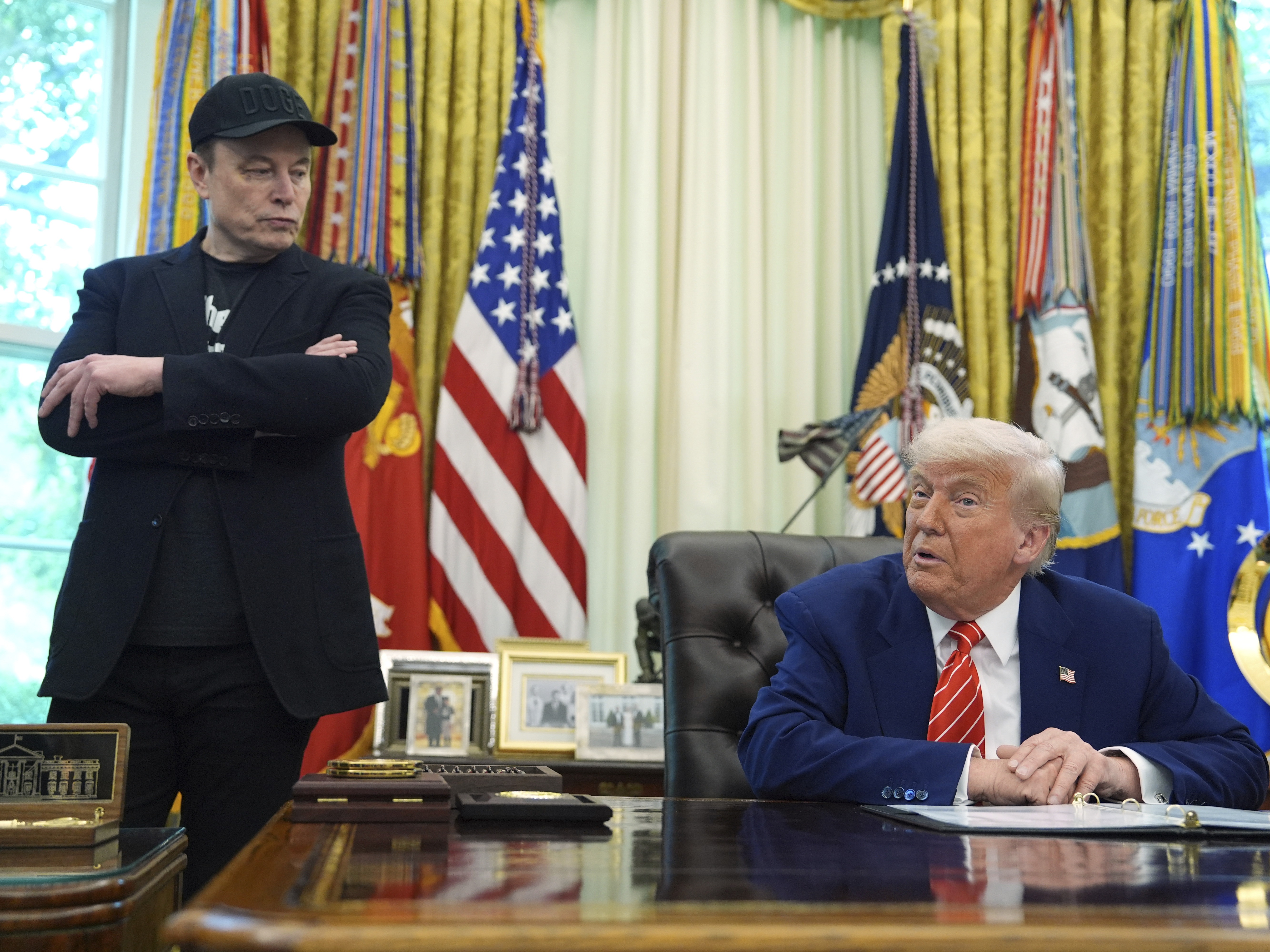 caption: President Donald Trump, right, speaks during a news conference with Elon Musk in the Oval Office of the White House, Friday, May 30, 2025, in Washington.
