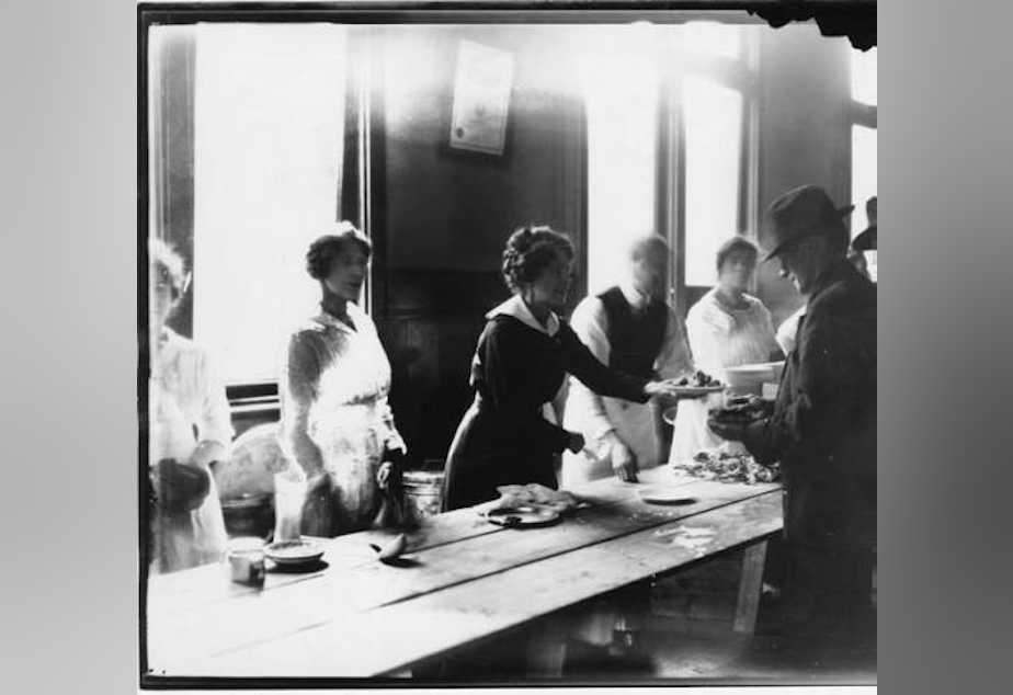 caption: From Wikimedia Commons: "The strike committee set up soup kitchens and distributed as many as 30,000 meals each day. In the photo, a woman serves a plate of food to a striking worker."