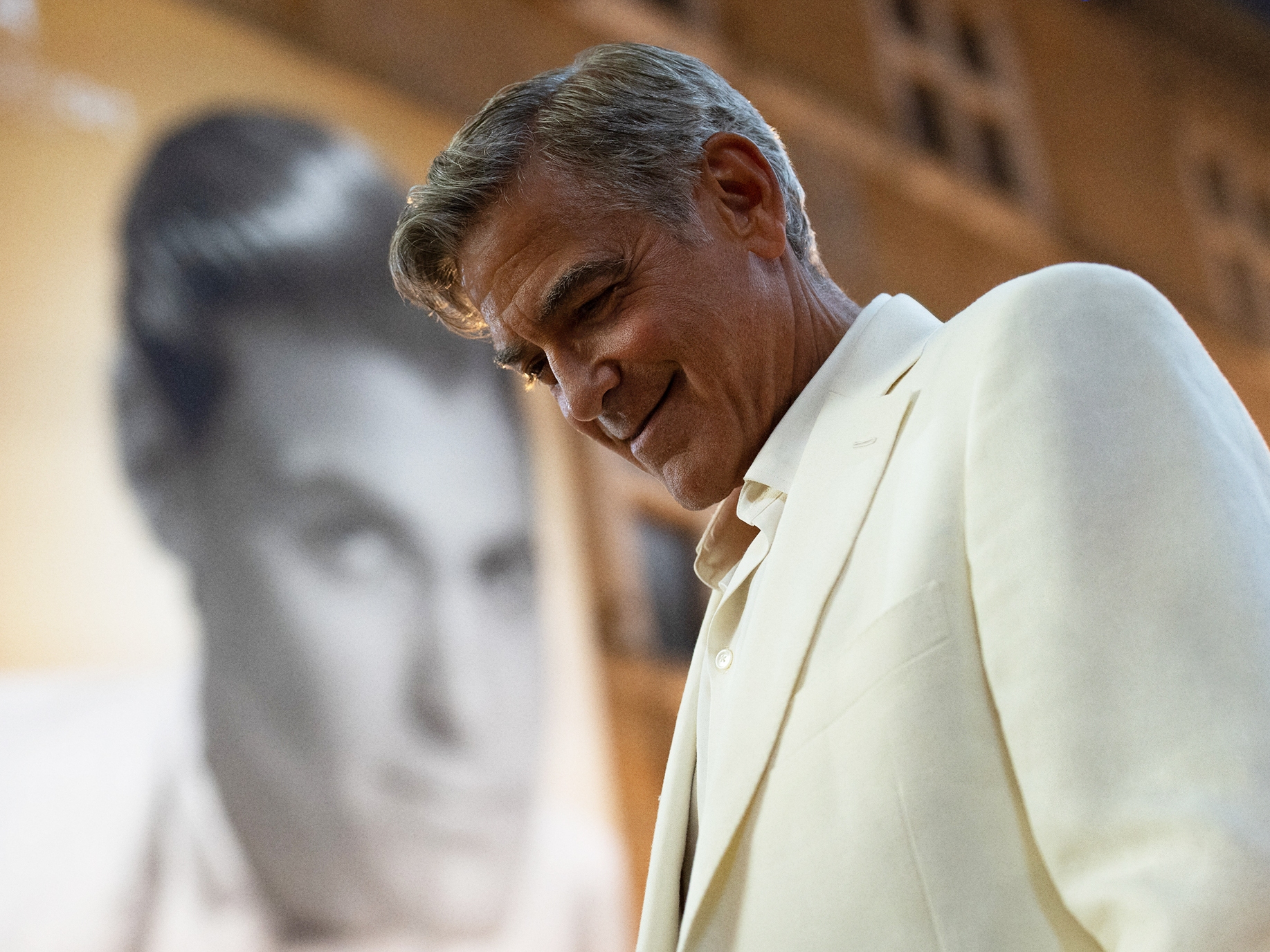 caption: George Clooney plays the title character in the film <em>Jay Kelly, </em>available on Netflix Dec. 5.