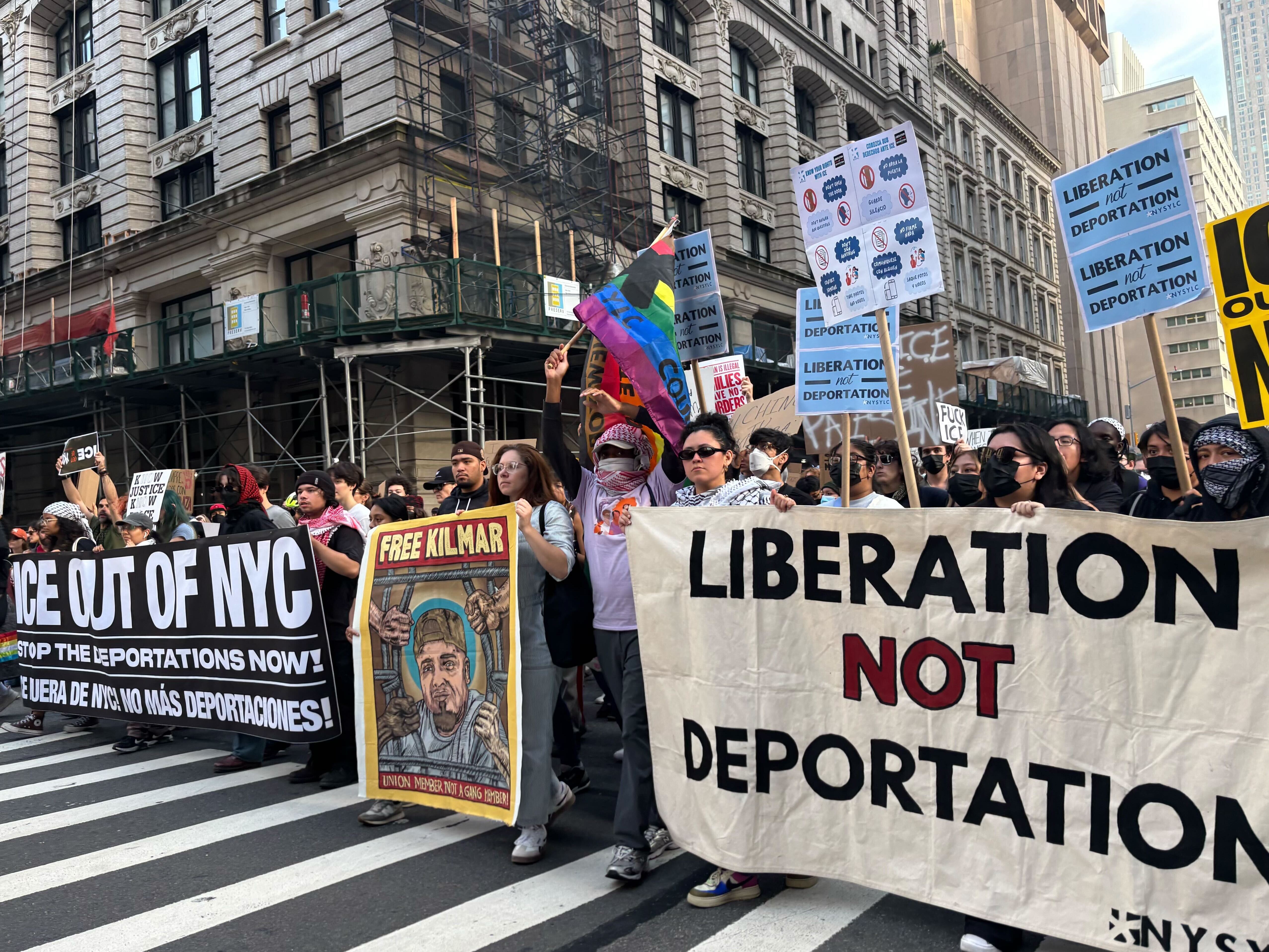 caption: Thousands of people marched throughout the streets of Manhattan Tuesday night as part of a series of nationwide rallies against President Trump's immigration sweeps and the deployment of the U.S. military in California.