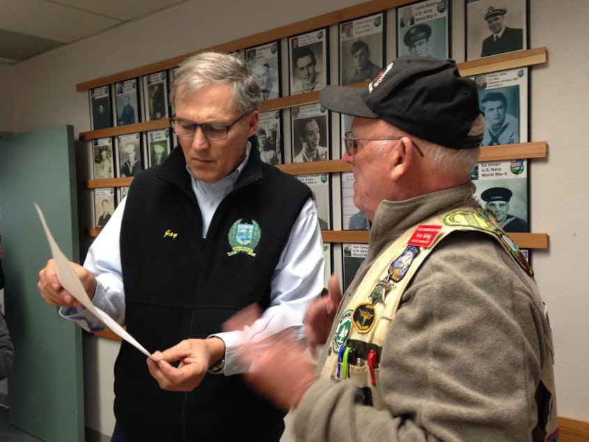 caption: Governor Jay Inslee talks with Darrington resident Pete Selvig at Darrington's City Hall Monday evening.