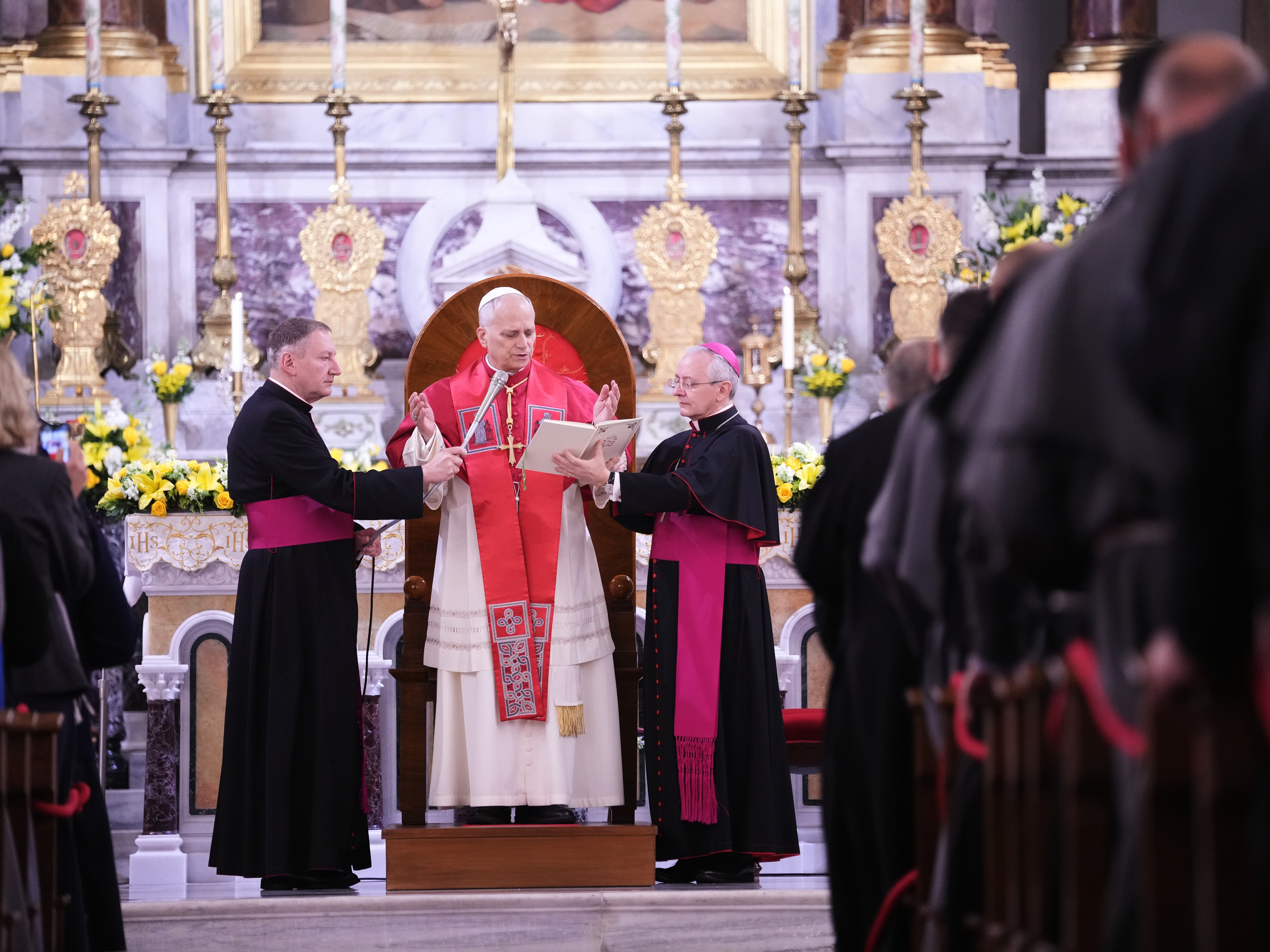 caption: Pope Leo XIV delivers his speech as he meets the clergy at the Cathedral of the Holy Spirit, in Istanbul, Turkey, Friday, Nov. 28, 2025.