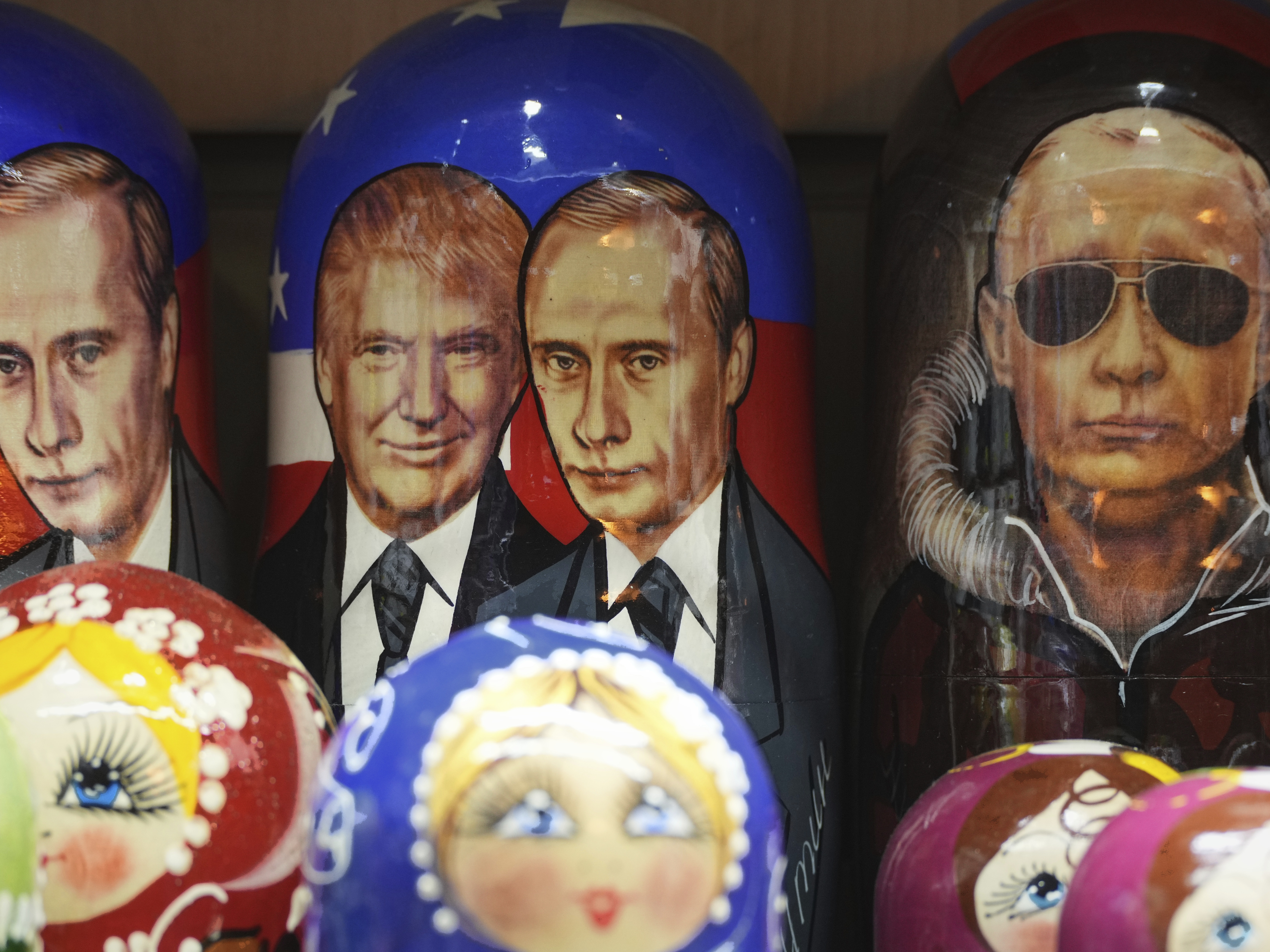 caption: A Matryoshka, the traditional Russian wooden dolls, depicting U.S. President Donald Trump and Russian President Vladimir Putin is displayed for sale at a souvenir shop in St. Petersburg, Russia, Wednesday, Aug. 13, 2025.