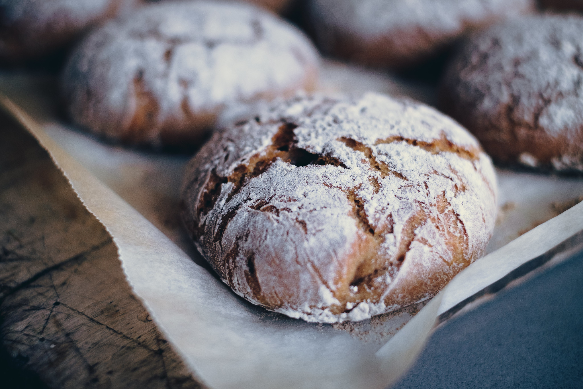 caption: Loaves of sourdough exit the oven.