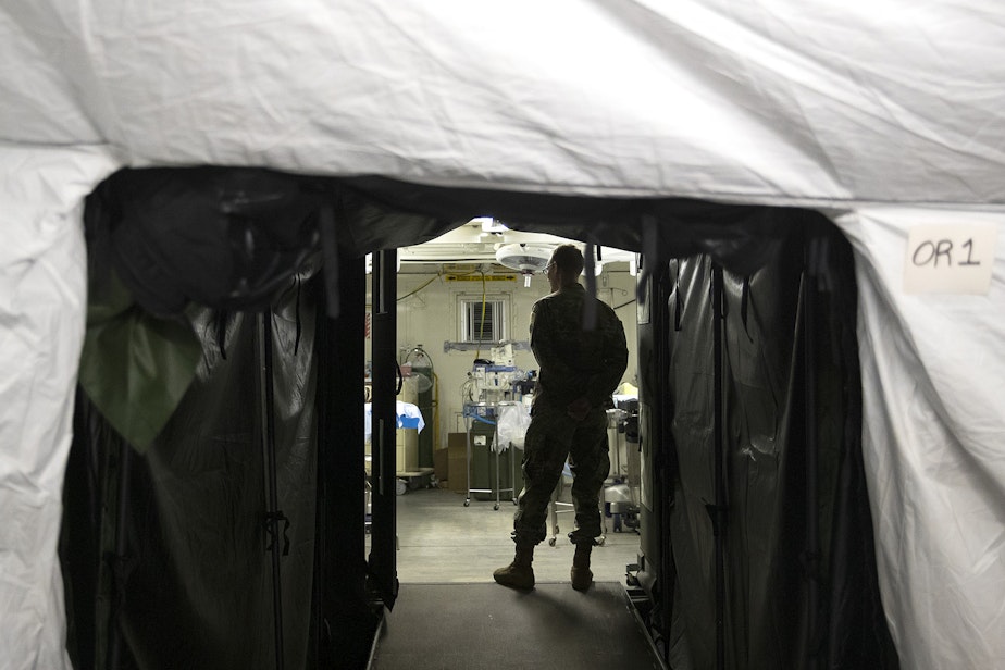 caption: A tunnel into the operating suite is shown at the military field hospital inside CenturyLink Field Event Center on Sunday, April 5, 2020, in Seattle. The 250-bed hospital for non COVID-19 patients was deployed by U.S. Army soldiers from the 627th Army Hospital from Fort Carson, Colorado, as well as soldiers from Joint Base Lewis-McChord.