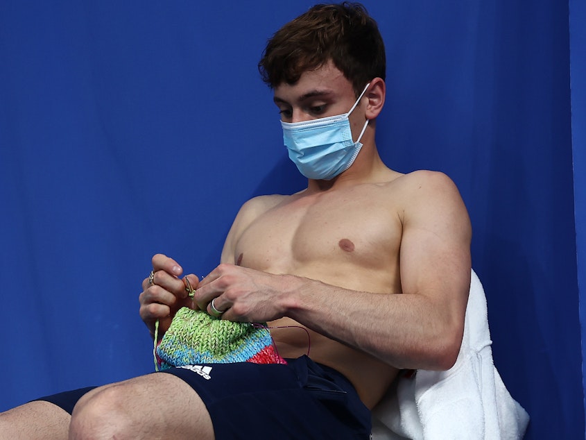 caption: Tom Daley said his work on knitting projects helped him stay calm between events at the Tokyo Olympics, where he won a gold medal. He recently launched an online store, selling knitting kits.