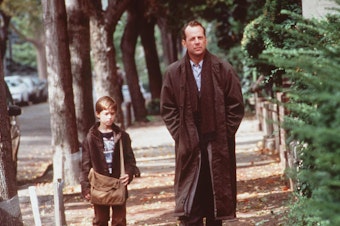 caption: Haley Joel Osment And Bruce Willis in <em>The Sixth Sense</em> in 1999.
