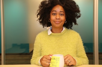 caption: Eula Scott Bynoe, co-host of Battle Tactics for Your Sexist Workplace,  doing her best impression of Michael Scott from "The Office."