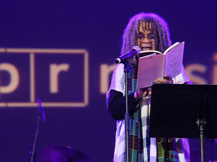caption: Sonia Sanchez reads from her book <em>Like the Singing Coming Off the Drums</em> during an NPR Music event in 2019.