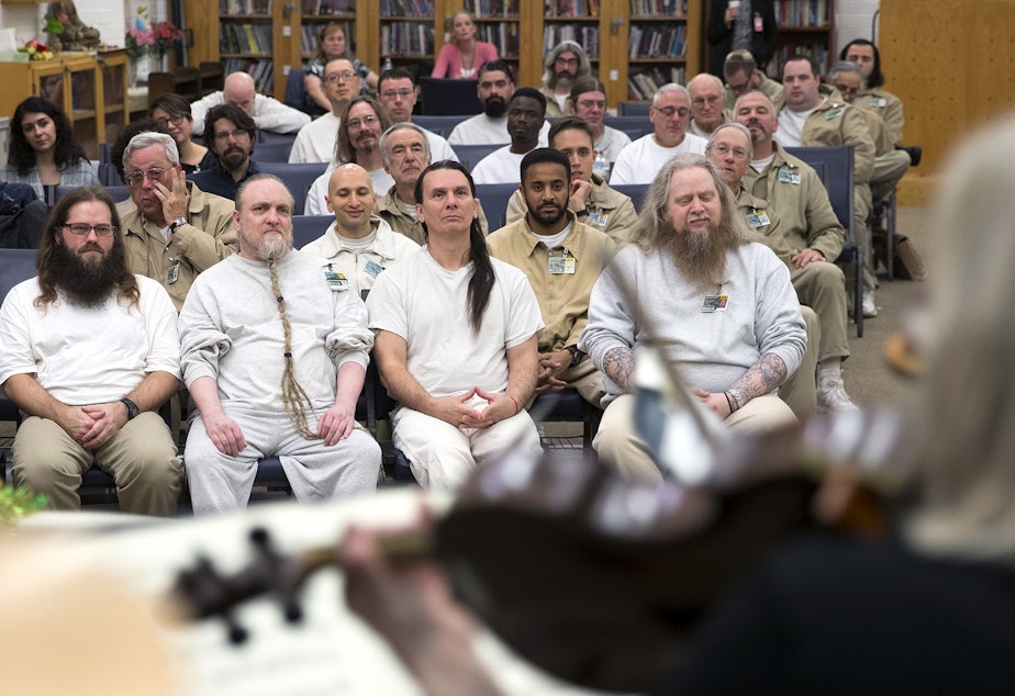 caption: Incarcerated individuals listen to members of the Seattle Symphony perform on Wednesday, November 29, 2018, at the Monroe Correctional Facility. Tap or click on the first image to see more.
