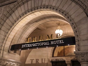 caption: The Trump International Hotel is seen on March 22, 2019 in Washington, DC.