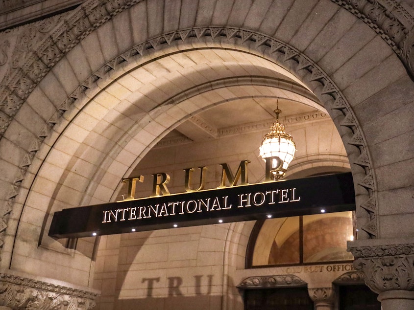 caption: The Trump International Hotel is seen on March 22, 2019 in Washington, DC.