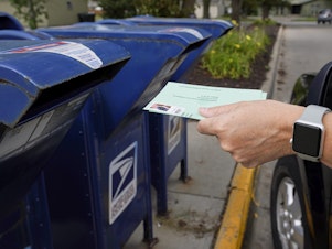 caption: The House passed legislation Saturday to provide $25 billion to the Postal Service to help safeguard voting by mail ahead of the November election.