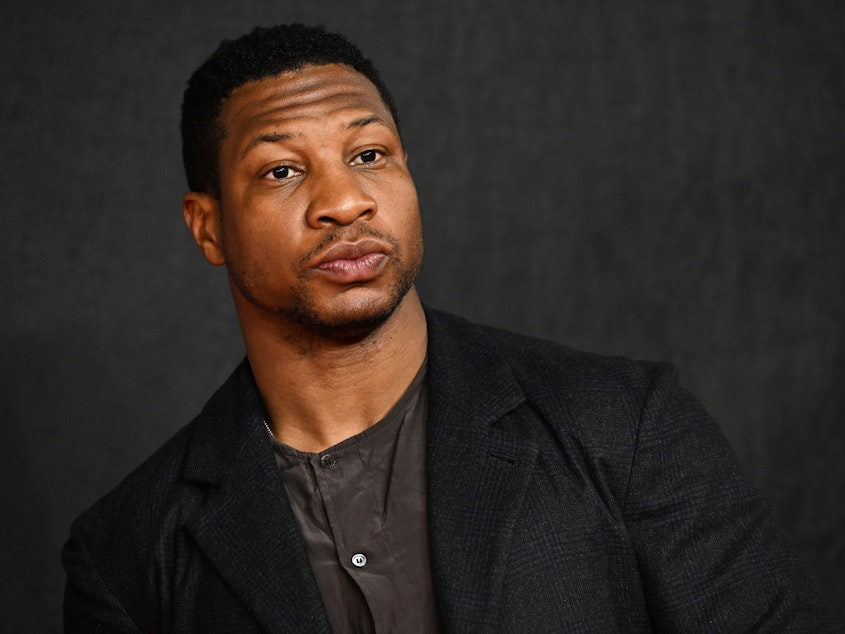 caption: Actor Jonathan Majors attending the London premiere of his film <em>Creed III</em> in Feb. 2023, before his career imploded due to a series of abuse allegations and a court conviction in New York.