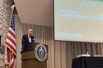 caption:  David Turk, federal Deputy Secretary of Energy, speaks to about 100 people during an informational meeting about potential clean energy development at Hanford.