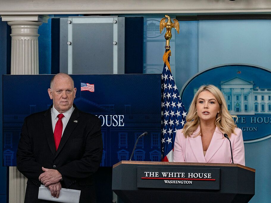 caption: Press Secretary Karoline Leavitt (right) speaks as border czar Tom Homan looks on during a White House briefing on Monday.