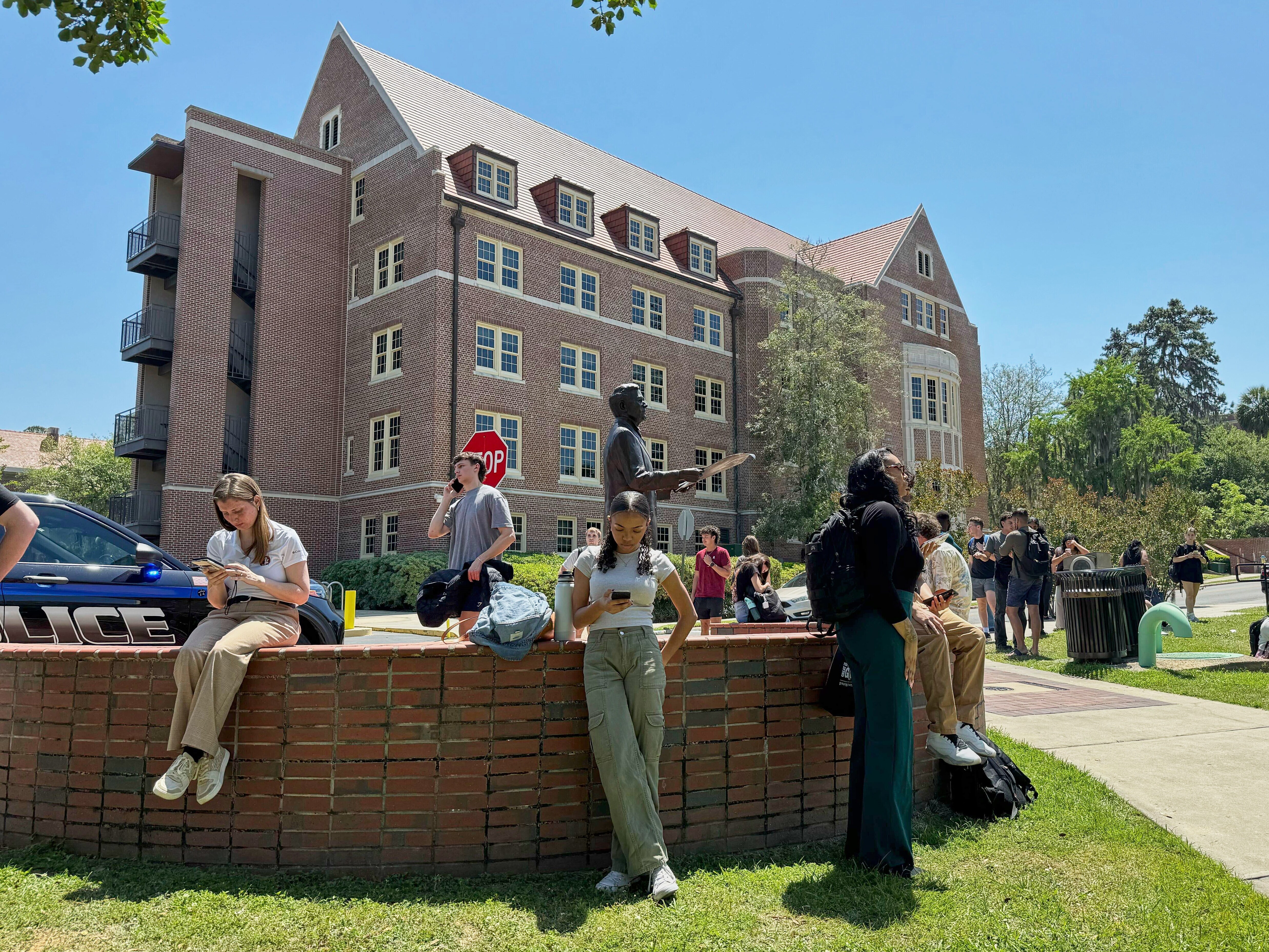 caption: Florida State University students wait for news amid an active shooter incident at the school's campus in Tallahassee, Fla., on Thursday.