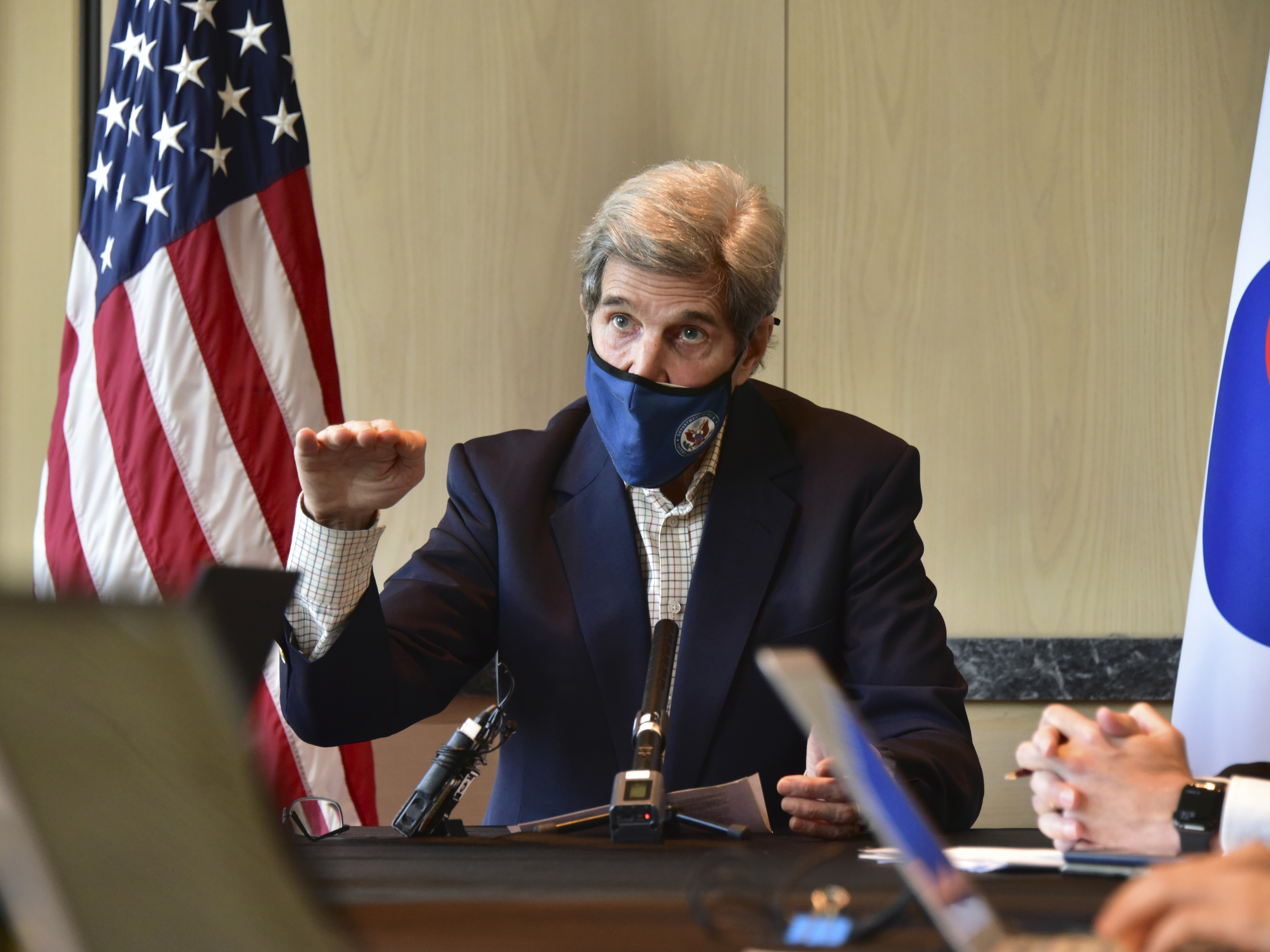 caption: U.S. special envoy for climate John Kerry speaks during a roundtable meeting with reporters in Seoul on Sunday. The United States and China have agreed to cooperate with other countries to curb climate change, just days before a virtual summit of world leaders to discuss the issue.