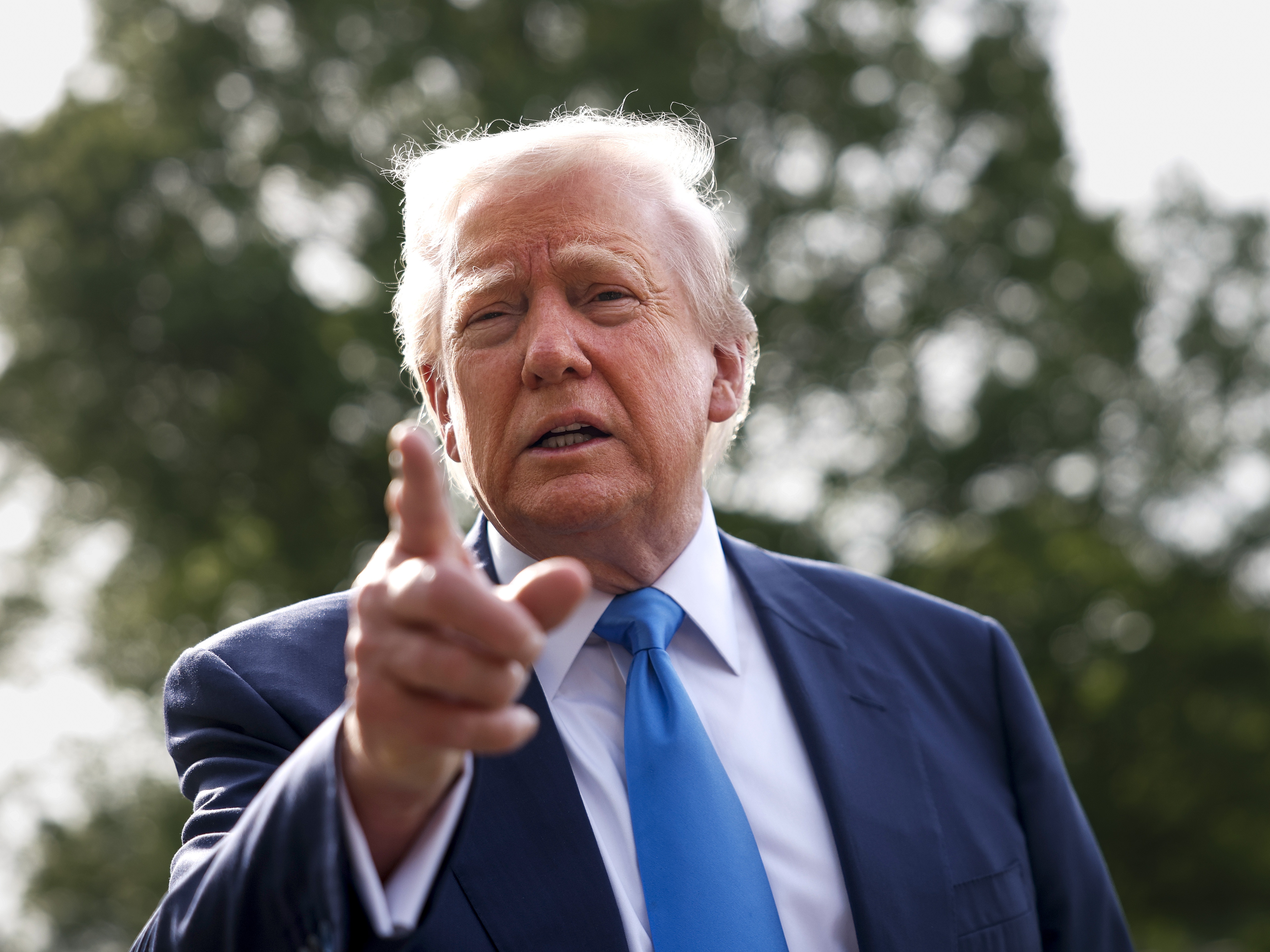 caption: President Trump speaks to the media as he departs the White House on April 25 in Washington, D.C., for Rome to attend the funeral of Pope Francis.