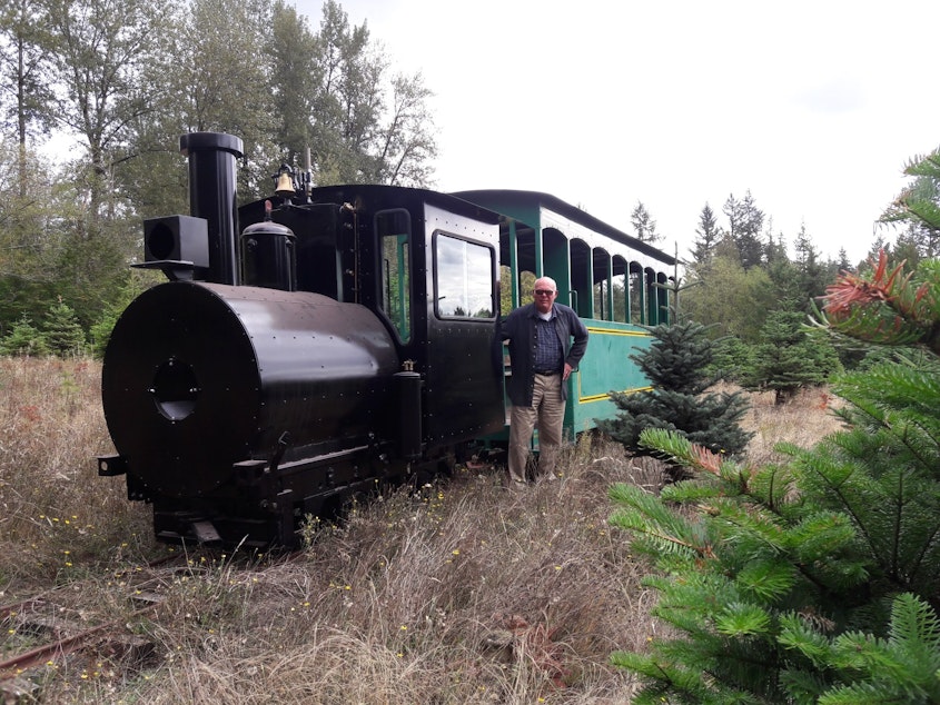 caption: Harvey Hawken built a working locomotive at Crystal Creek Tree Farm, in part, to save money on roads. After 18 years of work, he's finally ready to haul customers and their trees around his farm this year.