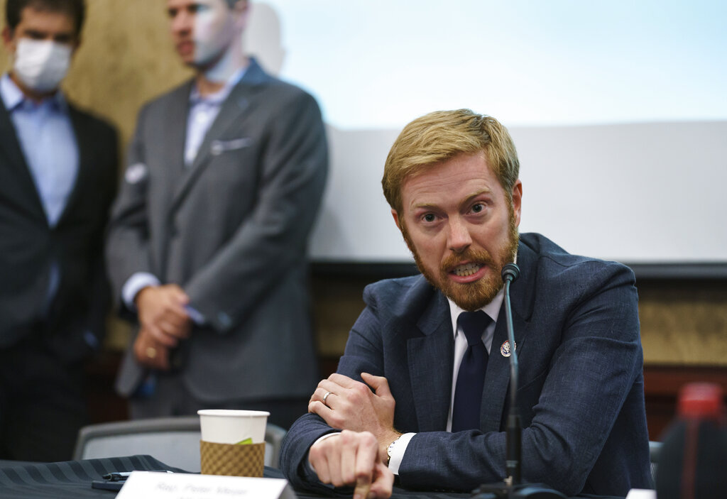 caption: Rep. Peter Meijer, R-Mich., speaks during a roundtable discussion with House Minority Leader Kevin McCarthy, R-Calif., and other Republicans as they criticize President Joe Biden on the Afghanistan evacuation, at the Capitol in Washington, Monday, Aug. 30, 2021.