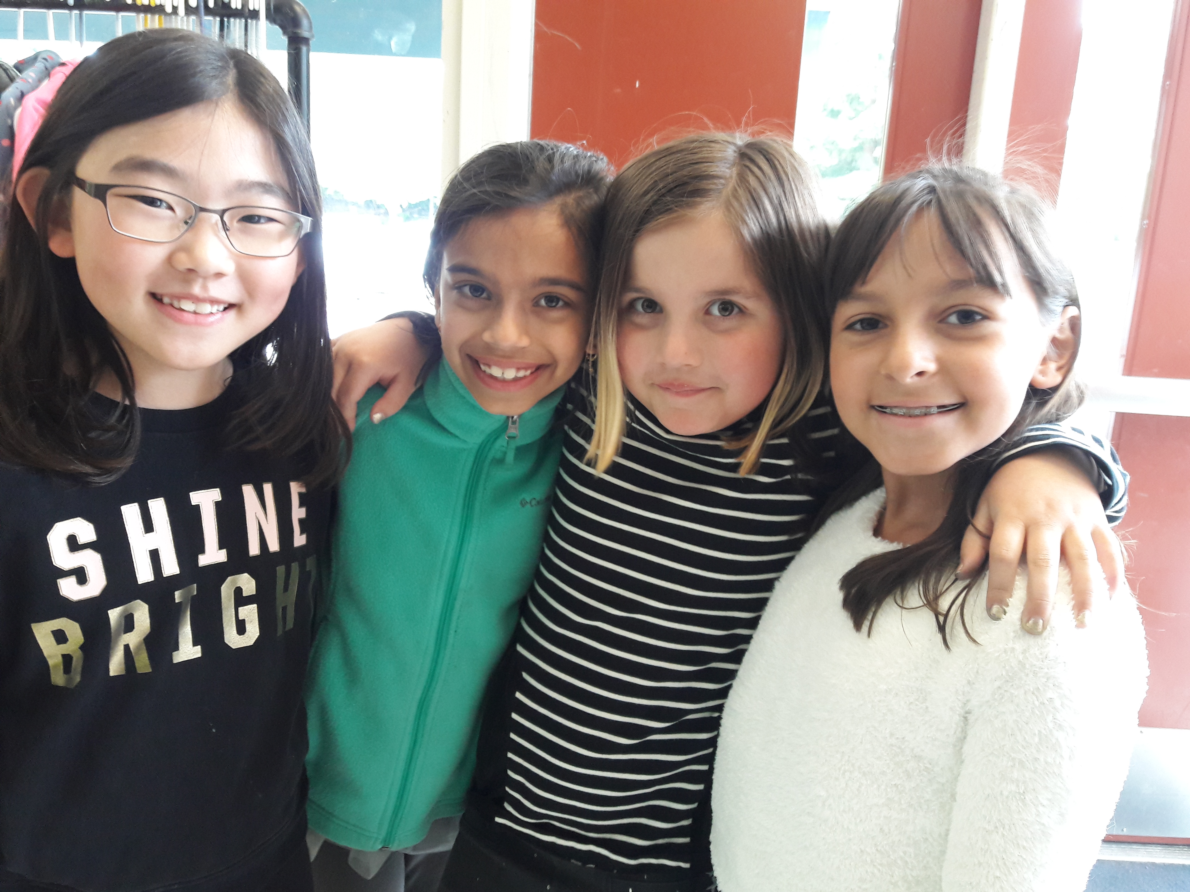 caption: Left to right, Rachel Park, Sonali Coehlo, Brooke Lell and  Judith Prado are part of the school's Green Team. They sort and organize the collected food before storing them in the fridge.