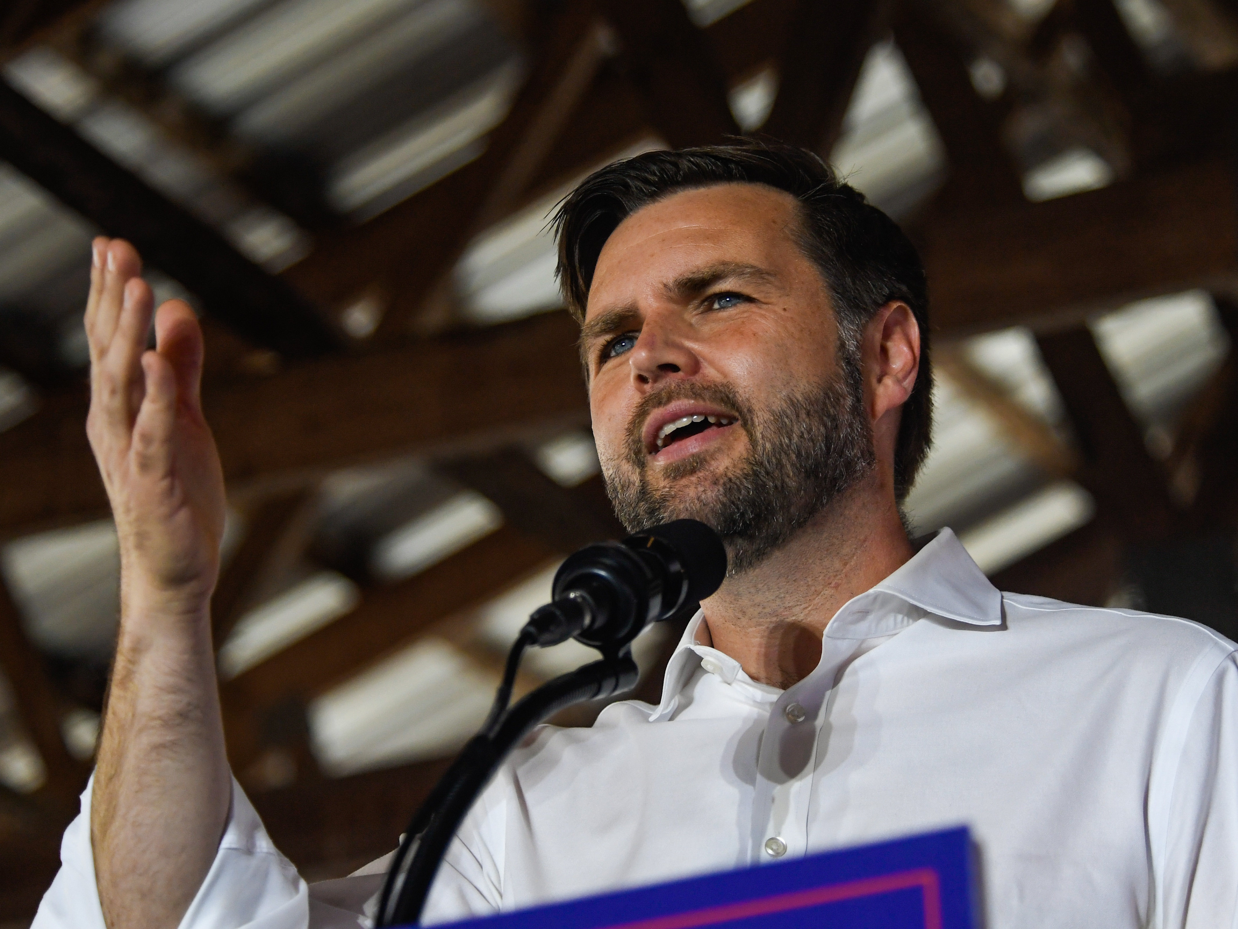 caption: Republican vice presidential nominee JD Vance speaks to a crowd during a rally at the Berks County Fairgrounds on Sept. 21, in Leesport, Penn.